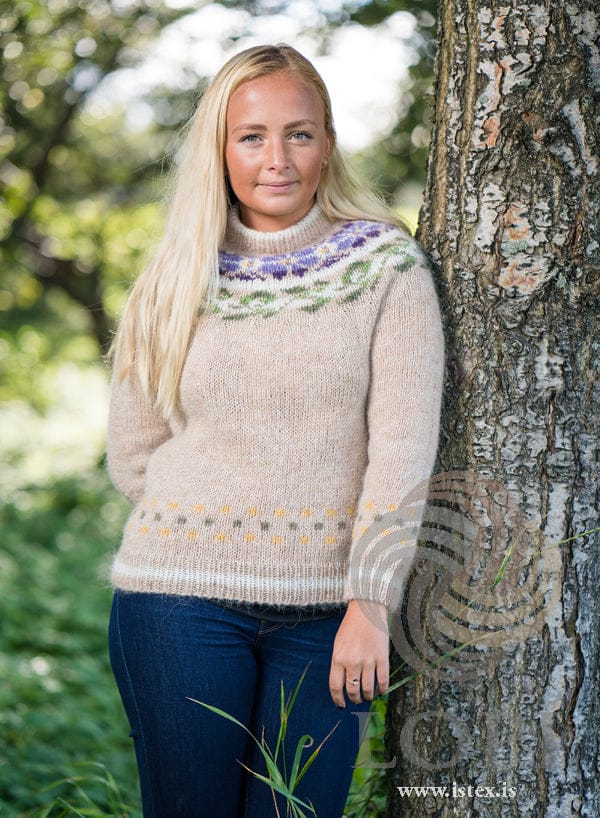 Manitoba sweater front, with the flower yoke and the border above the rib
