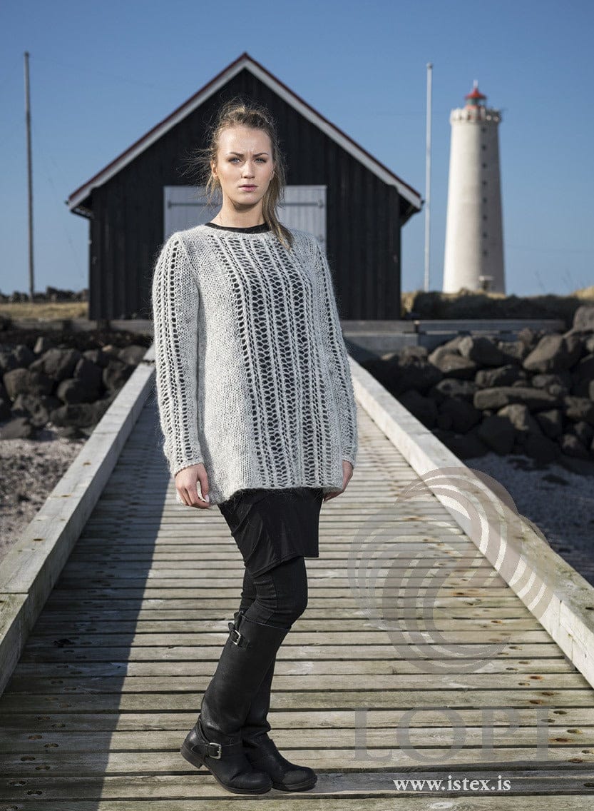 Warm dream Plötulopi lace sweater worn on a pier