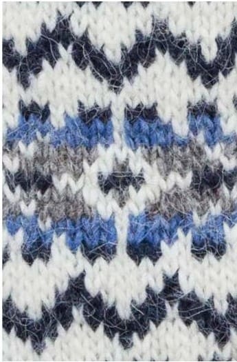 Close-up of the Rökkur colourwork in the pattern’s own colours — midnight blue zigzags on white, and bands of denim heather, midnight blue and grey heather