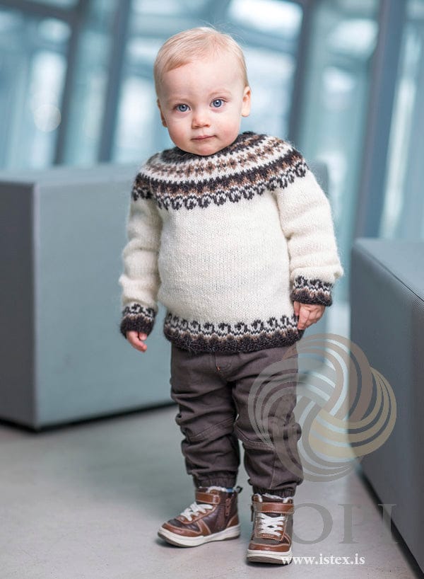 Toddler in the Bogi sweater — white Léttlopi with a black sheep and murky yoke and matching bands at hem and cuffs