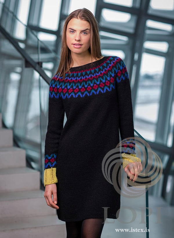 Dimma dress in black Einband with a royal blue, teal, brick and yellow yoke and yellow lace cuffs