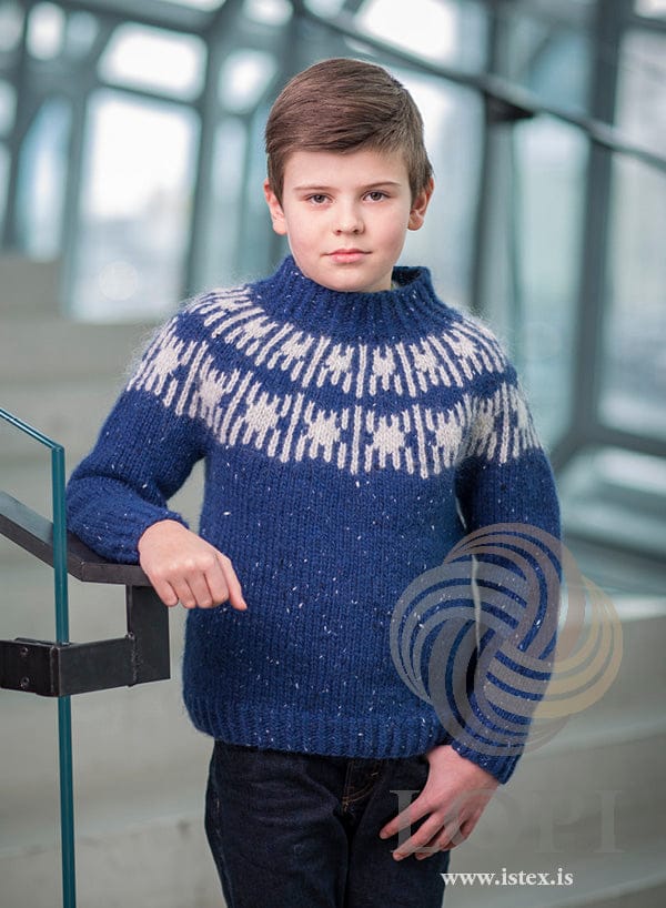 Boy in the Teikn sweater — blue tweed Álafosslopi with a light ash yoke pattern and a twisted-rib collar