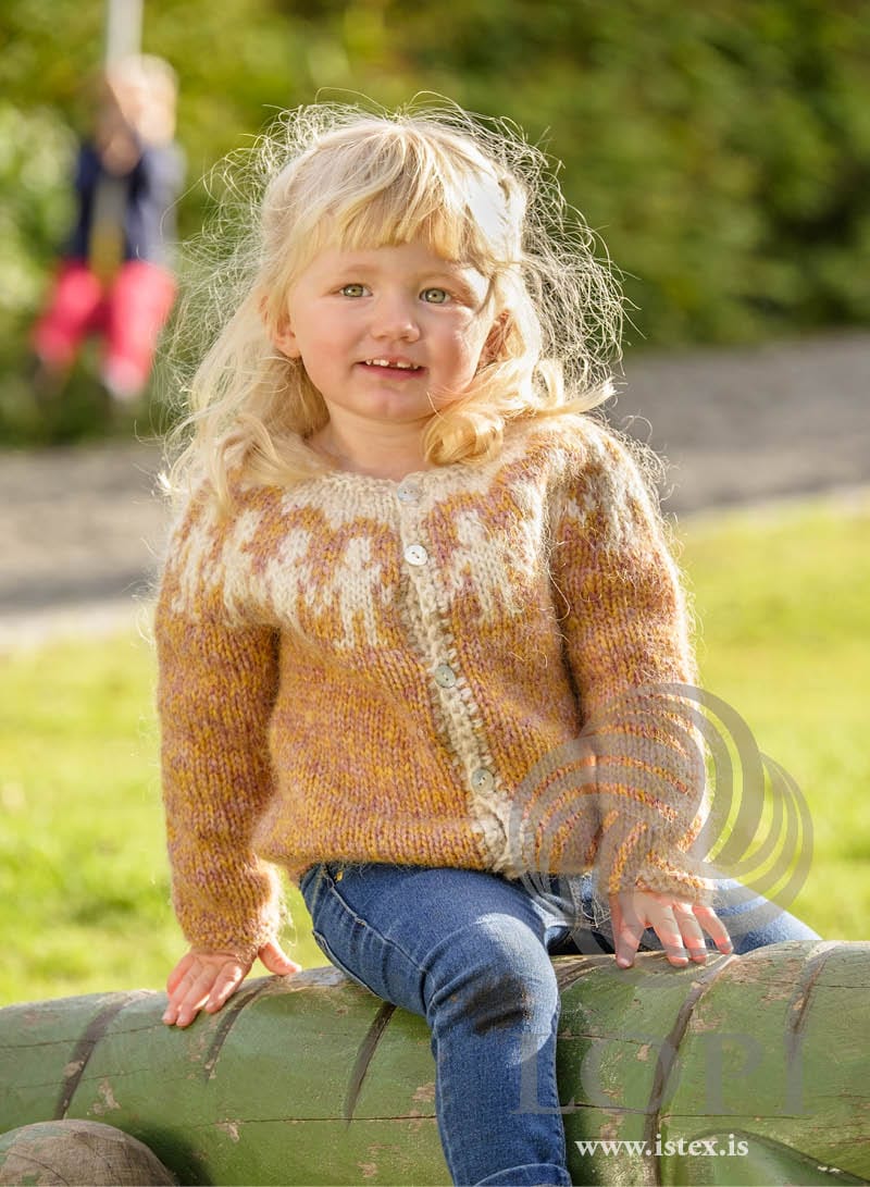 Litlu manneskjurnar children’s cardigan in the golden-peach colourway, with little white figures on the yoke (shown in the original colours)