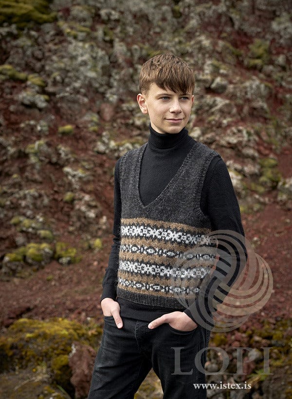 Brown Staka V-neck vest worn over a black turtleneck
