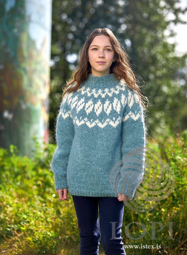 Vörn children’s yoke sweater knitted in Álafosslopi — glacier blue with a white yoke pattern and a ribbed collar