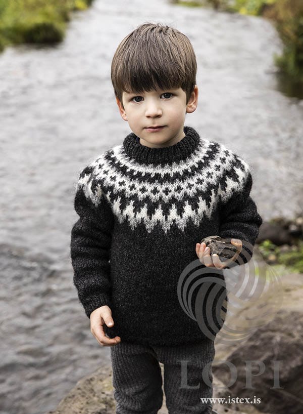 Æsa children’s yoke sweater in black heather Léttlopi with a light grey and white yoke