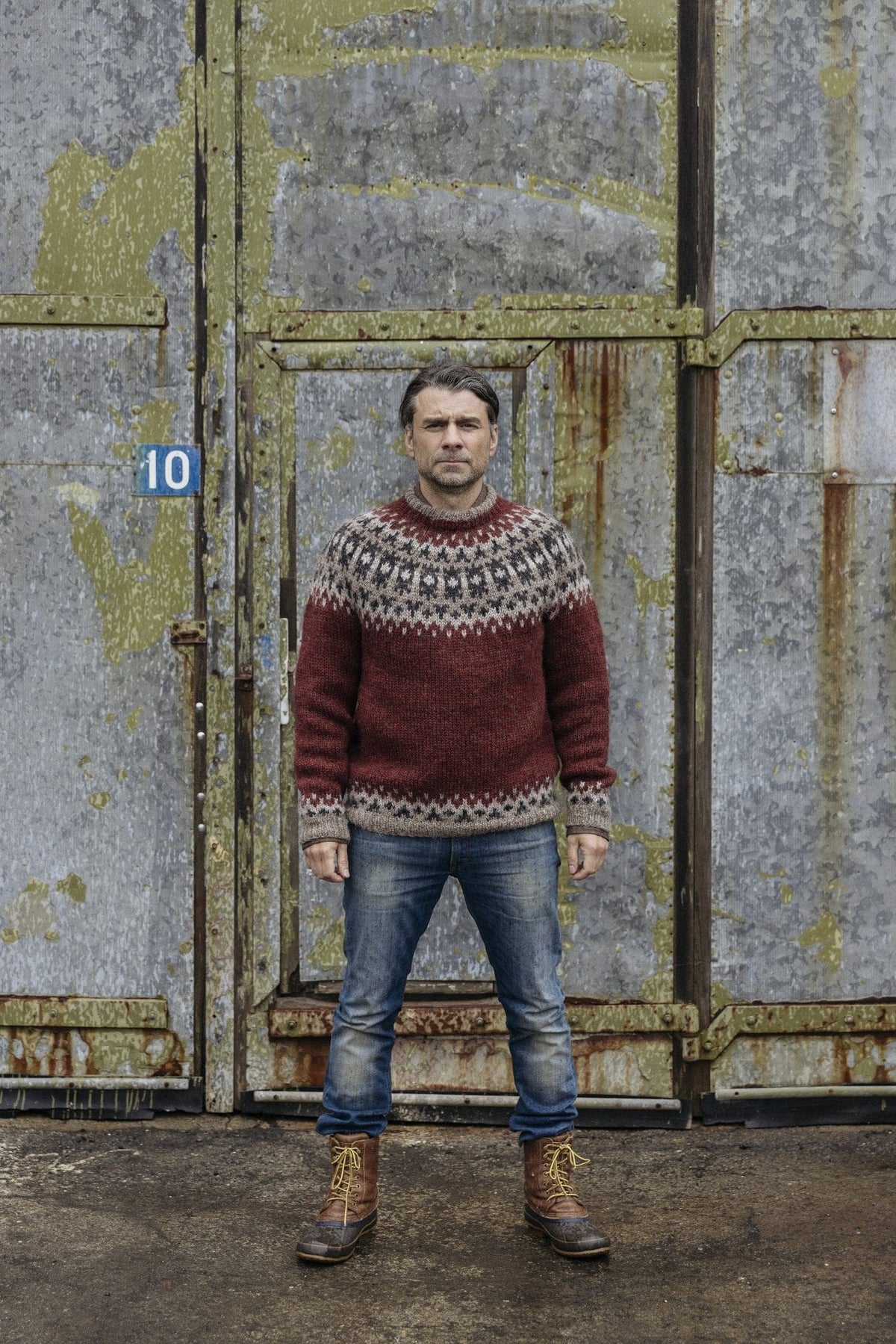 Hraglandi Icelandic yoke sweater knitted in Plötulopi — jasper red with an oatmeal, beige and black yoke