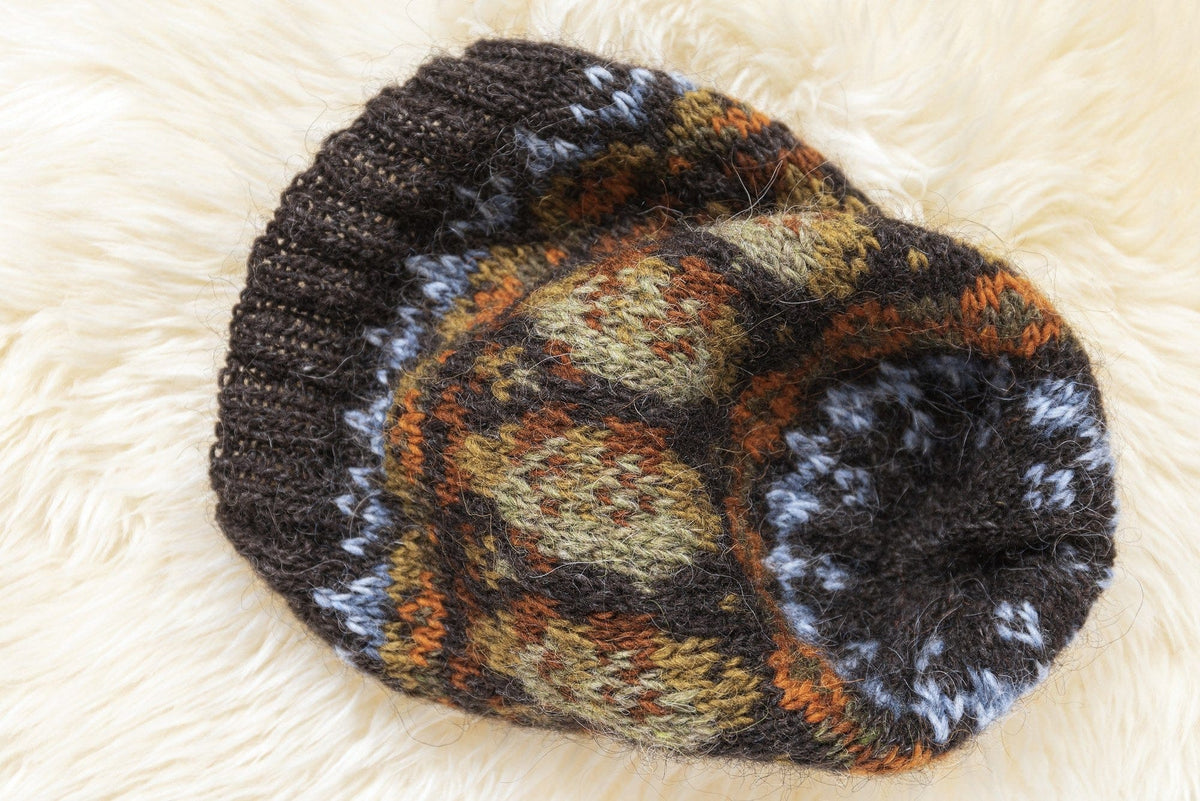 Lofoten Hat seen from above: the dark crown with light blue crosses, the oval band and the ribbed brim