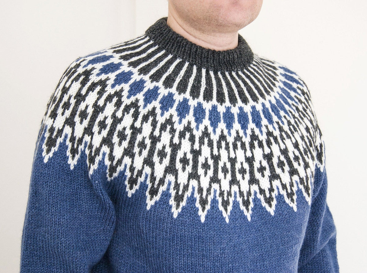 Close-up of the front of the blue Odin yoke, worn indoors