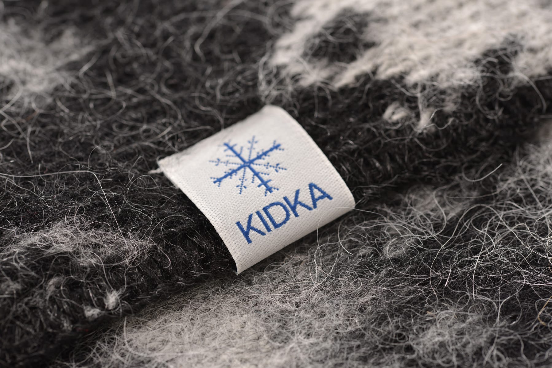 Kidka wool products from Iceland. Black and white horse patterned woolen blanket