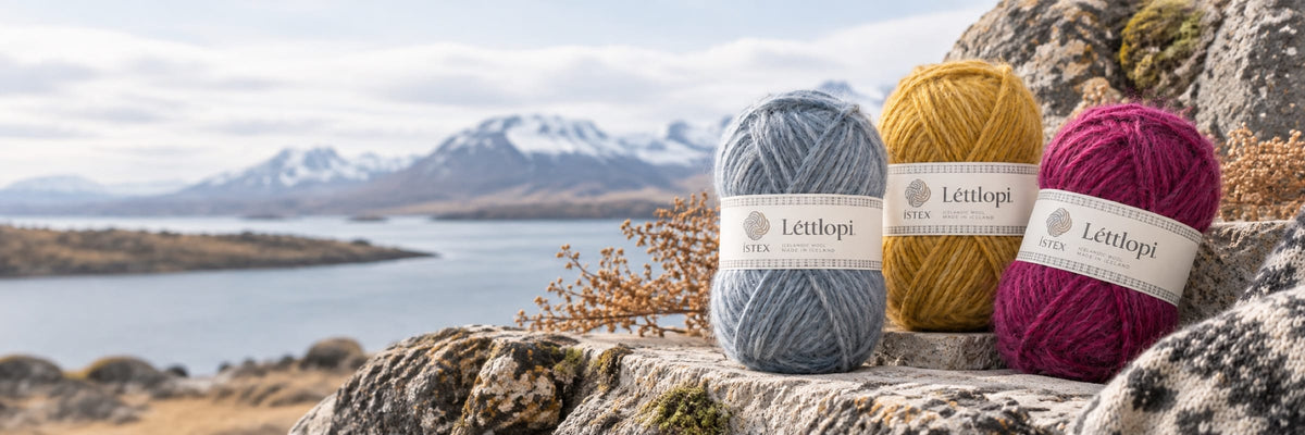Léttlopi yarn balls on a rock by an Icelandic fjord