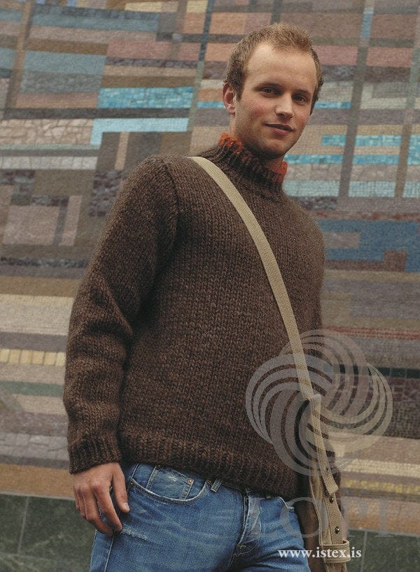 Man in the brown Strax sweater — chocolate Jöklalopi in plain stocking stitch, ribbed hem and cuffs, and a ribbed polo collar with a carrot red tip (shown in the original colours — this kit has oatmeal heather, a light beige, for the carrot red tip). The shoulder bag and jeans are not part of the pattern