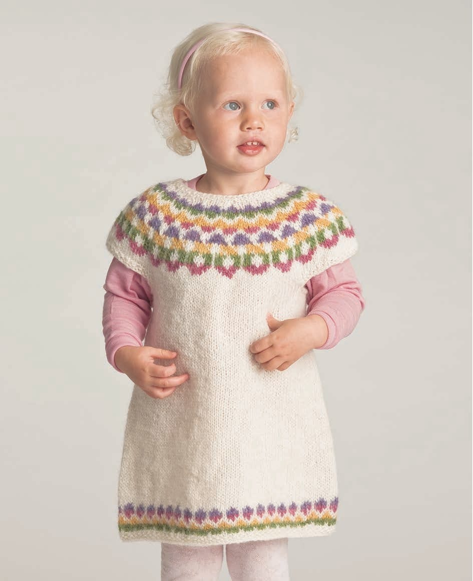 The same Teikn dress pattern in its white version, with pink, green, yellow and lilac figures — sold as a separate kit. The pink long-sleeved top, the tights and the hairband are not part of the pattern