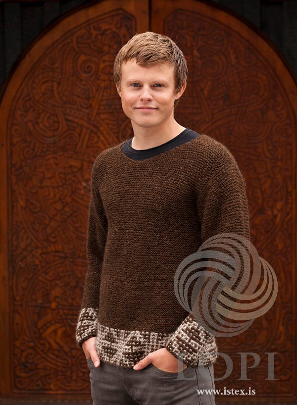 Man in the Örk sweater — chocolate heather Léttlopi in garter stitch with a light beige slip-stitch hem and cuffs
