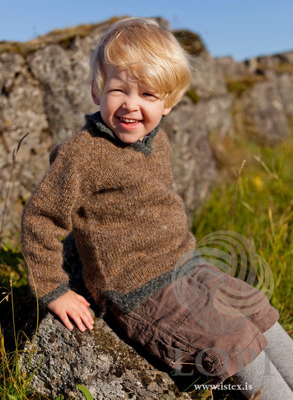Child in the Kapp sweater — murky Léttlopi with rough sea basket-weave edges and a slit neckline