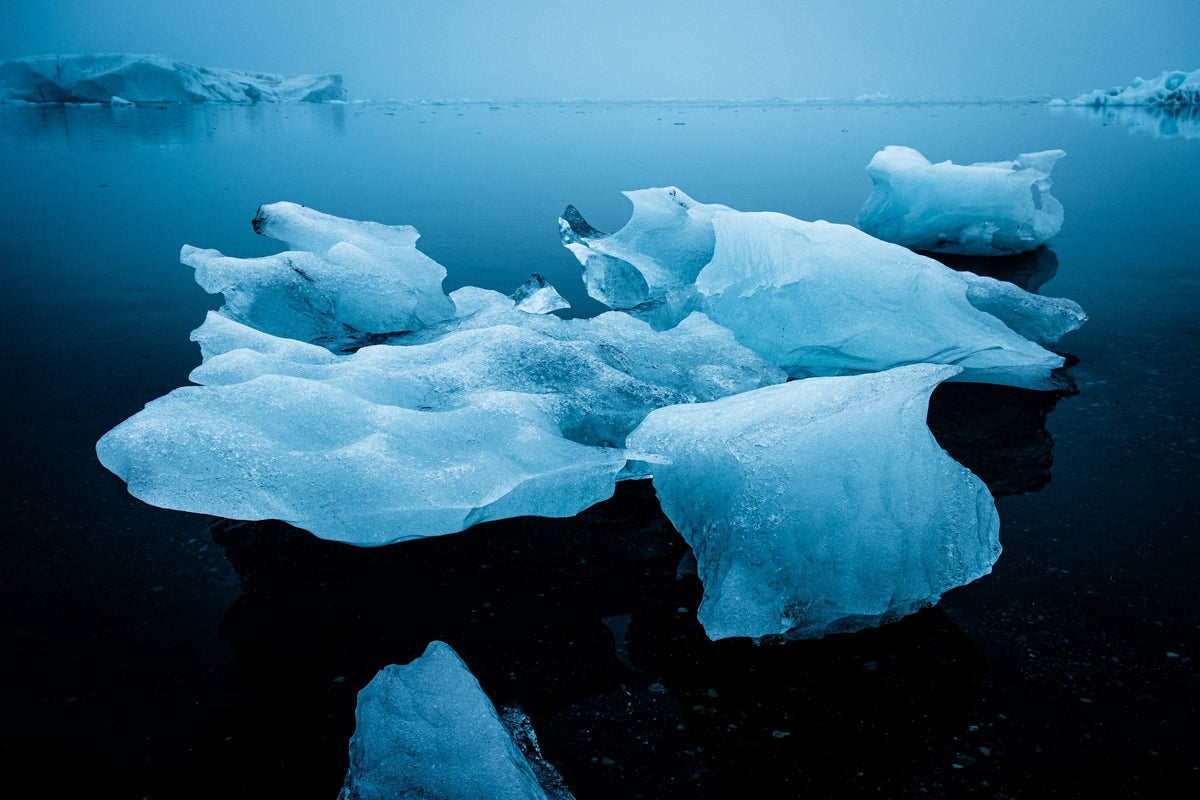 Blue icebergs on a still Icelandic glacier lagoon